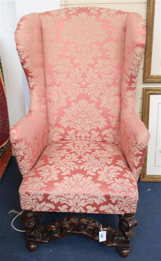 A late 17th century wing armchair